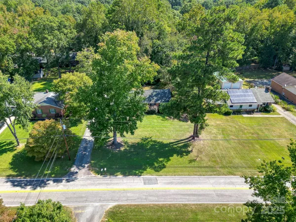 a view of a yard with potted plants