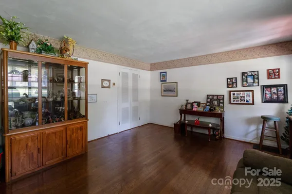 a view of a livingroom with furniture and wooden floor