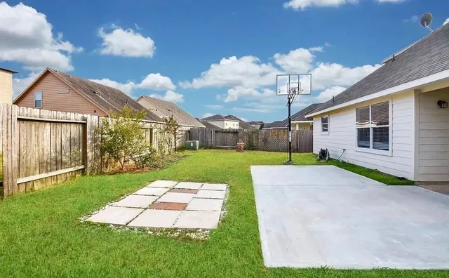 a living room with furniture and a dining table with projector