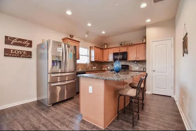 a living room with furniture or couch and a flat screen tv
