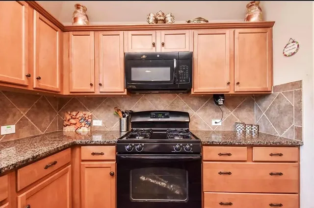 a spacious bedroom with a bed and wooden floor