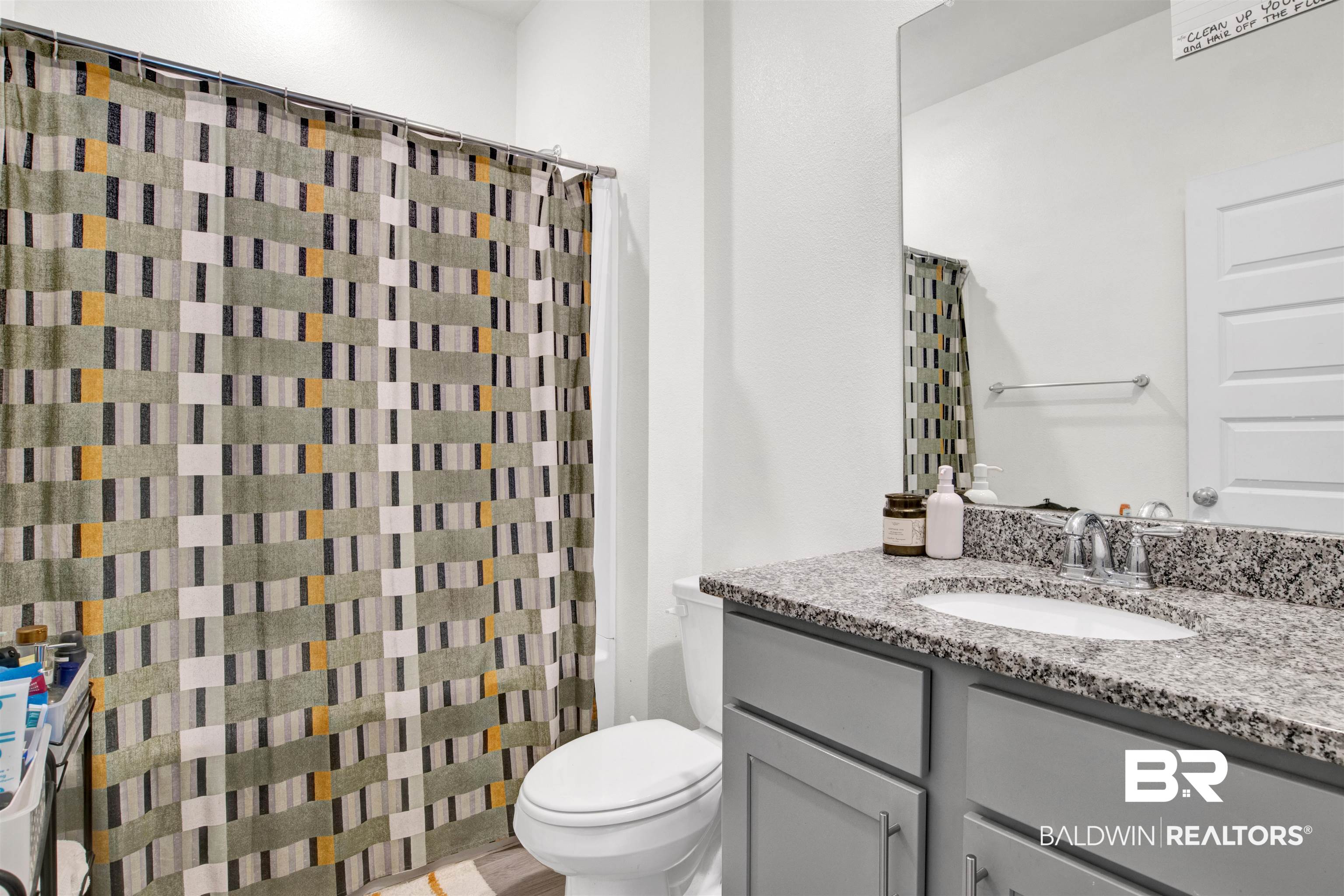 24253 Alydar Loop Daphne, AL 36526 - Photo 30 of 44 Bathroom featuring vanity and a shower with curtain