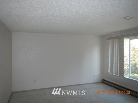 2517 Northeast 4th Street, Unit 524 Renton, WA 98056 - Photo 4 of 10 a view of an empty room with a window