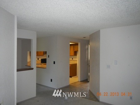 2517 Northeast 4th Street, Unit 524 Renton, WA 98056 - Photo 6 of 10 a view of a hallway with workspace