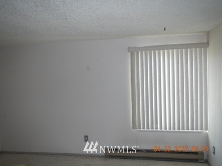 2517 Northeast 4th Street, Unit 524 Renton, WA 98056 - Photo 9 of 10 a view of an empty room with wooden floor