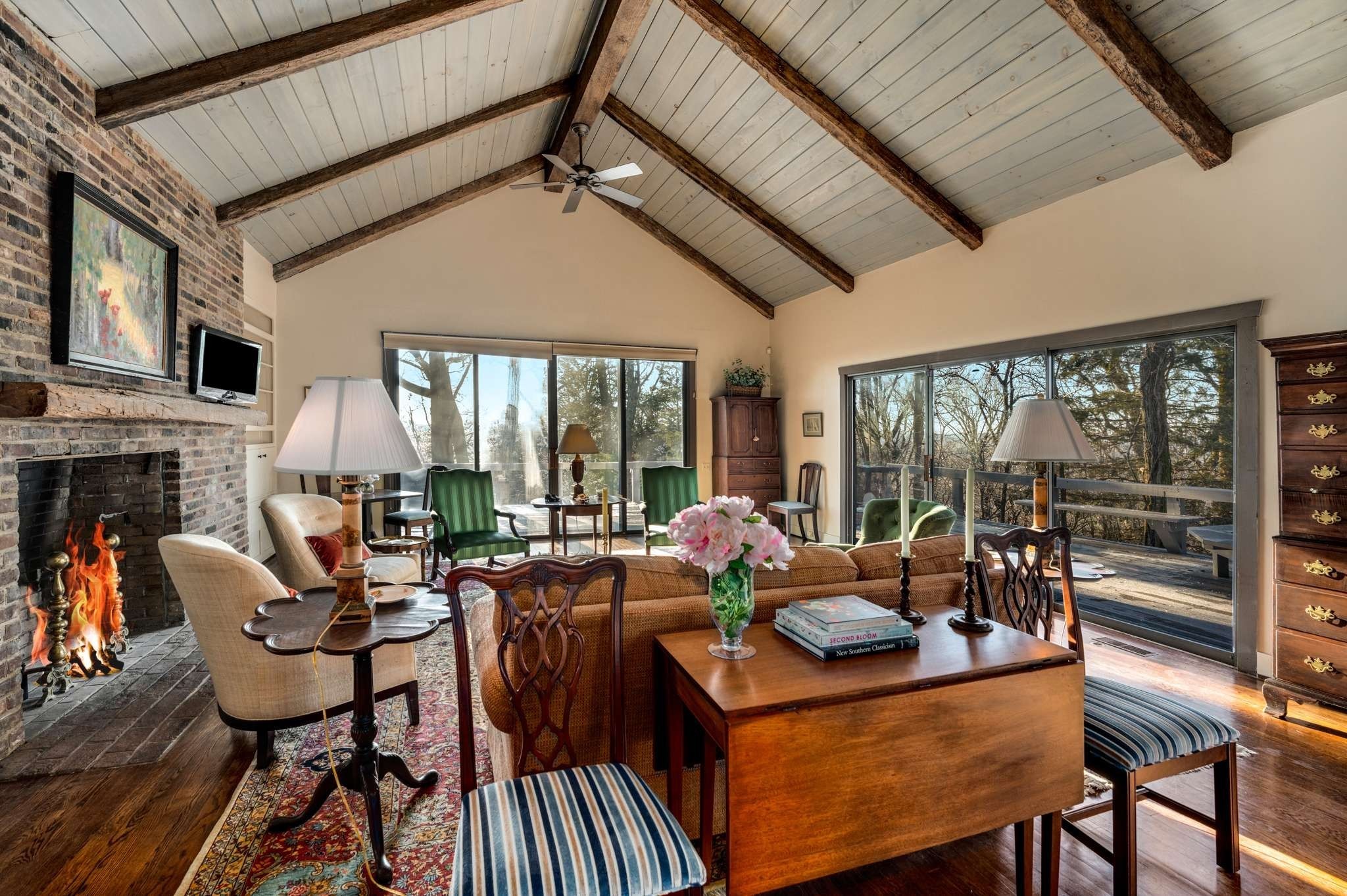 360 Vaughn Road Nashville, TN 37221 - Photo 3 of 36 a living room with furniture a fireplace and a floor to ceiling window