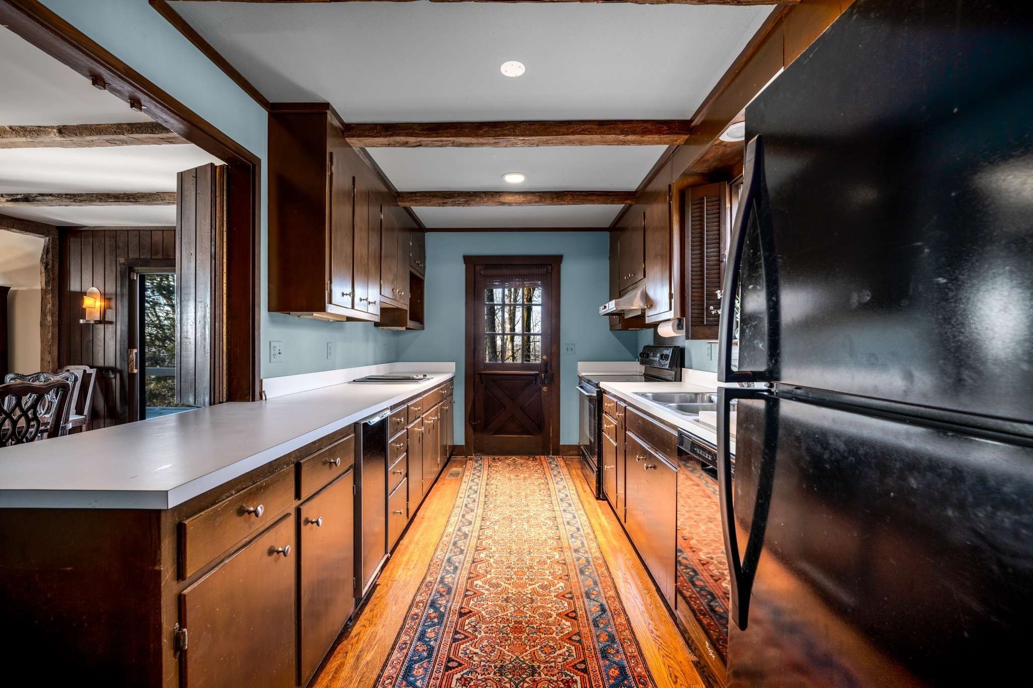360 Vaughn Road Nashville, TN 37221 - Photo 6 of 36 a kitchen with stainless steel appliances granite countertop sink stove top oven and cabinets