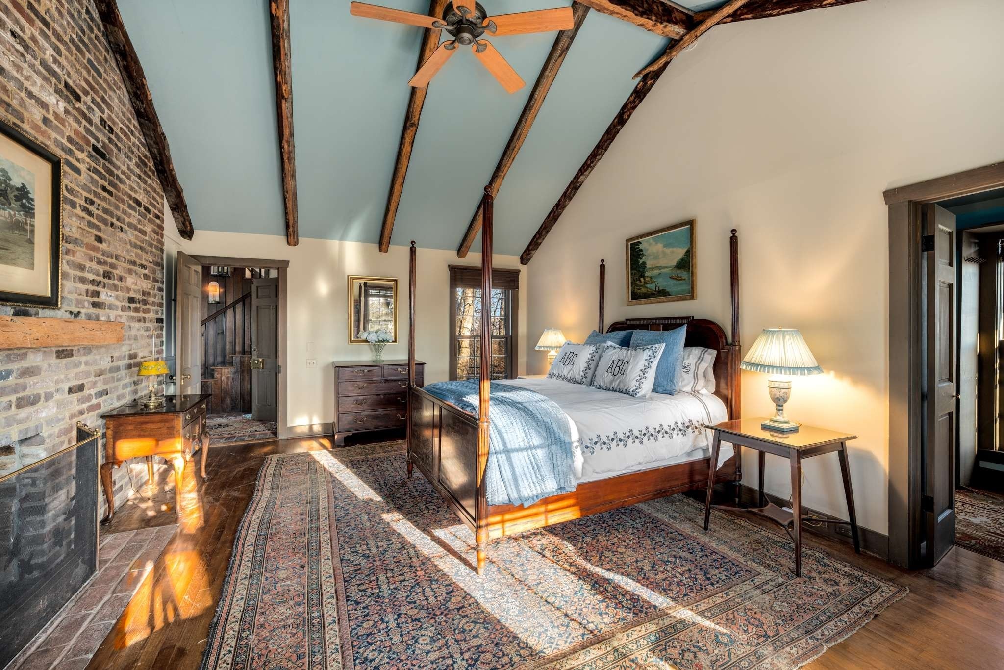 360 Vaughn Road Nashville, TN 37221 - Photo 8 of 36 a spacious bedroom with a bed a couch and a dresser next to a window