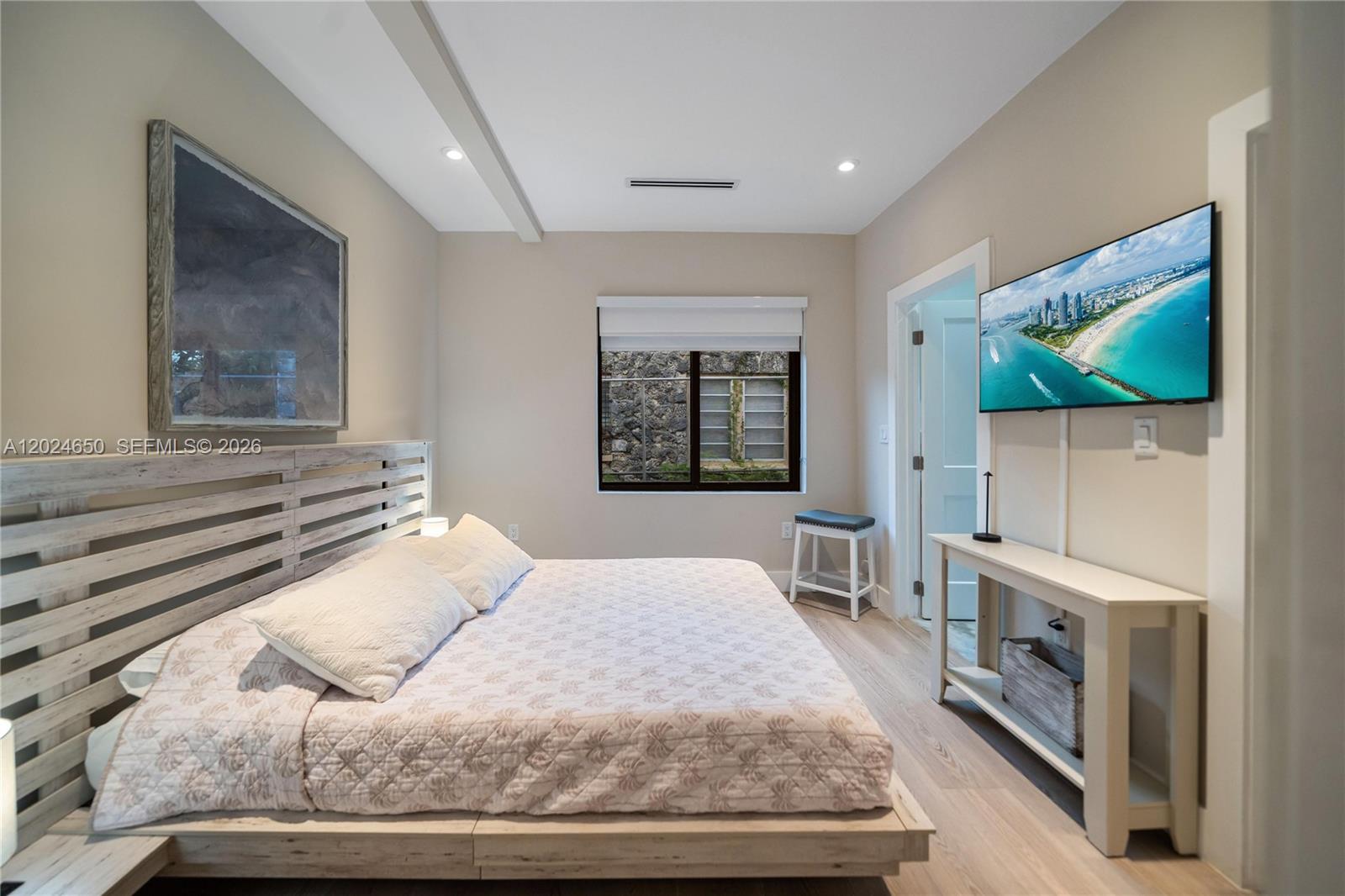 1663 Southwest 13th Street Miami, FL 33145 - Photo 36 of 112 a bedroom with a bed and a flat screen tv