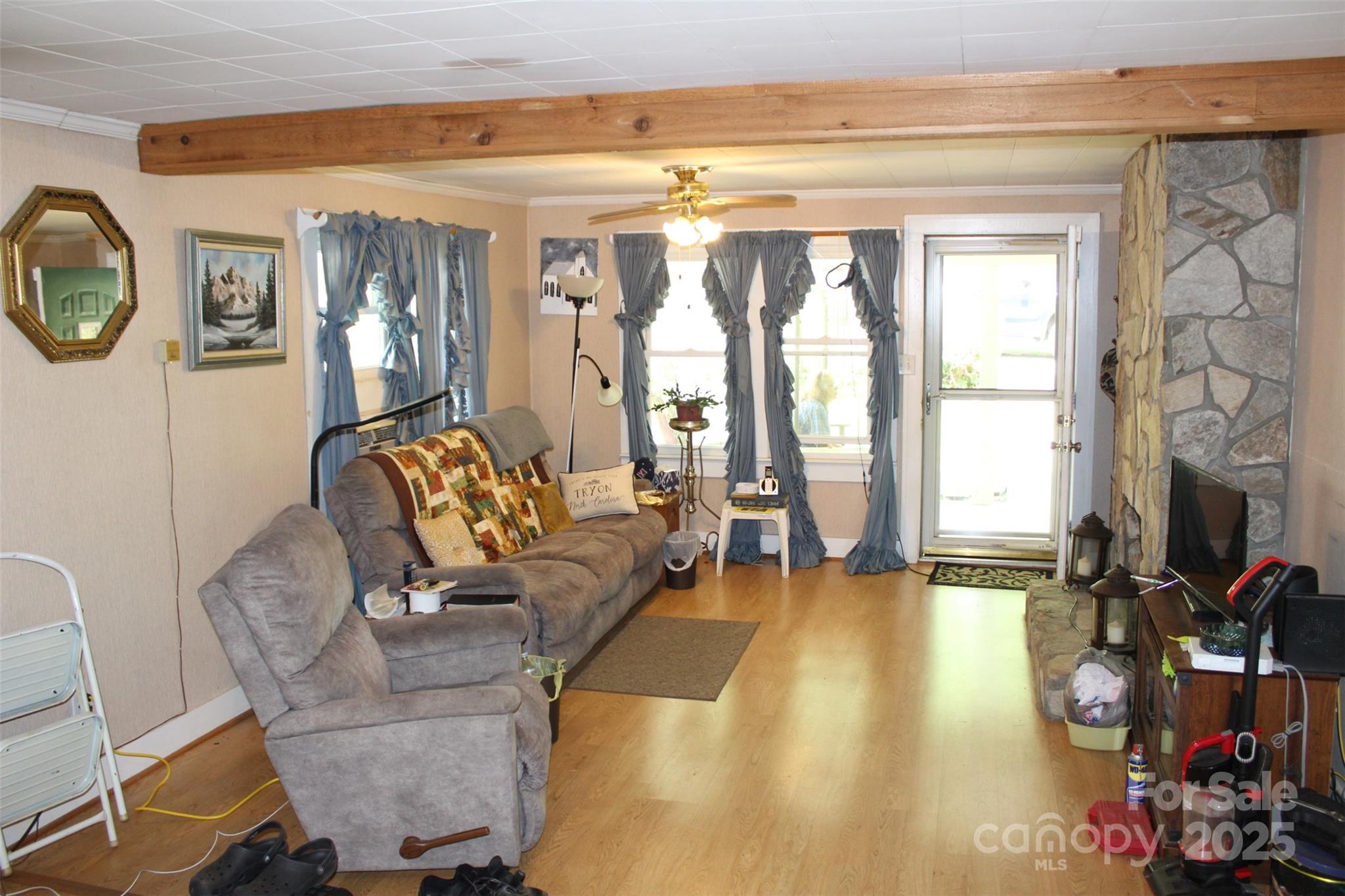 68 Rector Street Tryon, NC 28782 - Photo 11 of 29 a living room with furniture and a large window