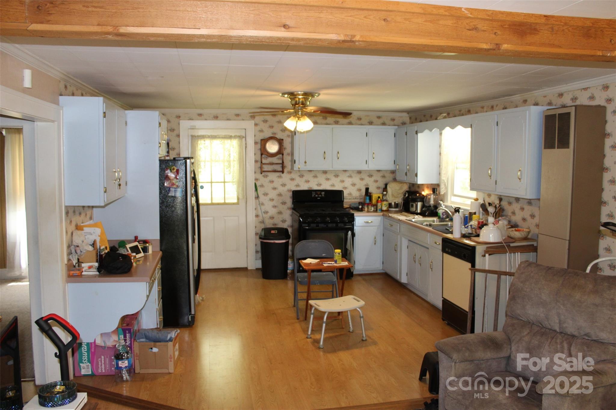 68 Rector Street Tryon, NC 28782 - Photo 14 of 29 a kitchen with sink refrigerator and cabinets