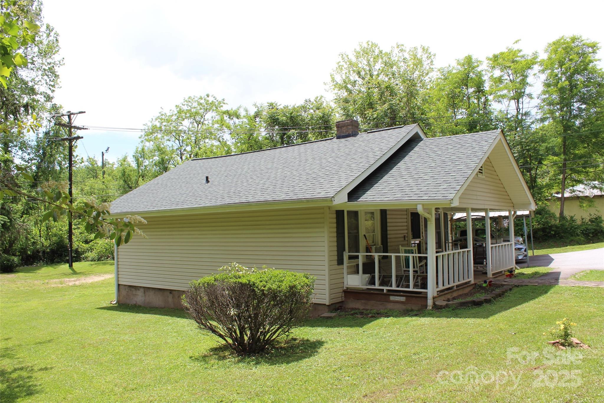 68 Rector Street Tryon, NC 28782 - Photo 4 of 29 a view of a house with a yard and sitting area