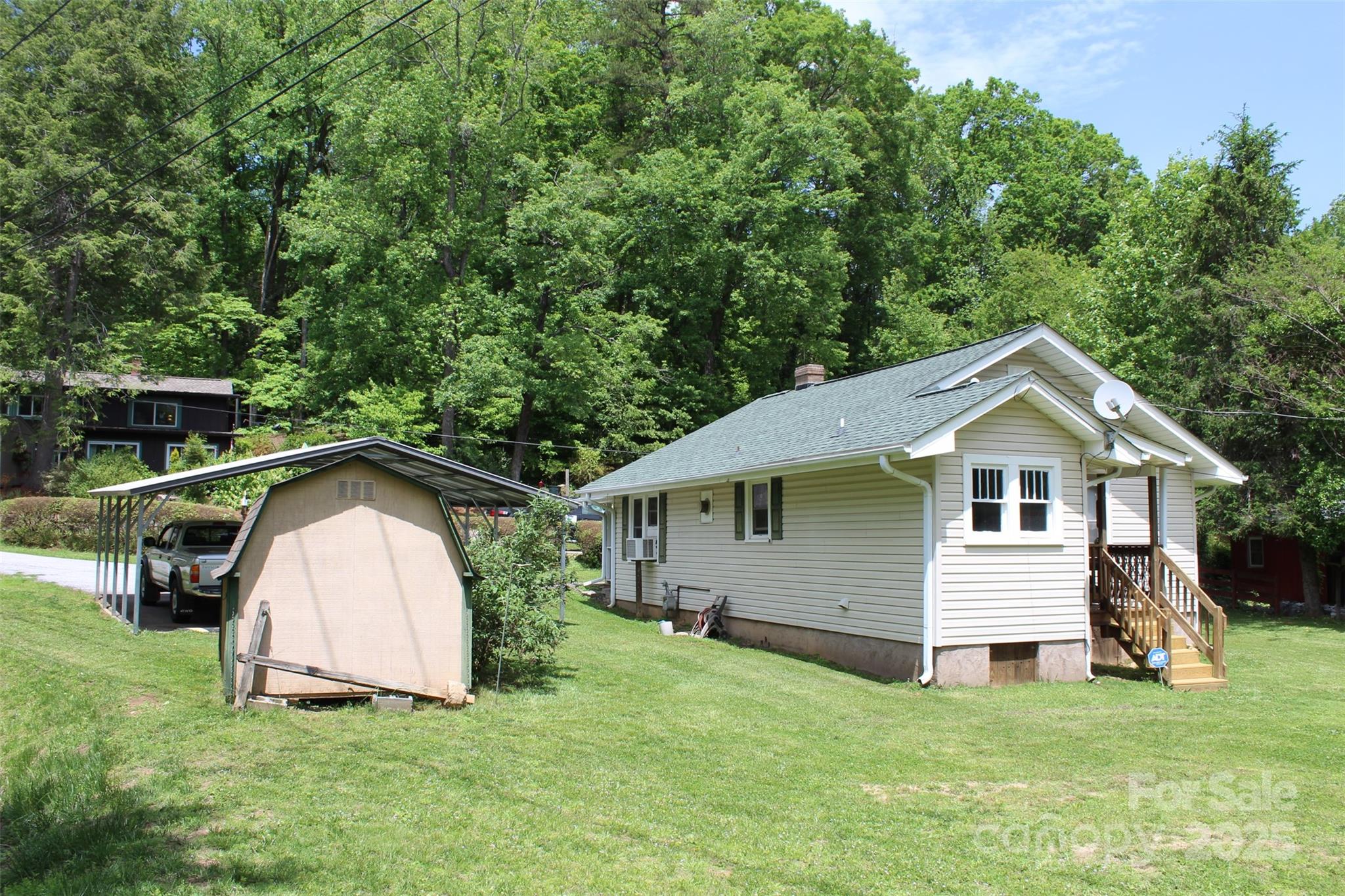 68 Rector Street Tryon, NC 28782 - Photo 6 of 29 a view of a house with a yard