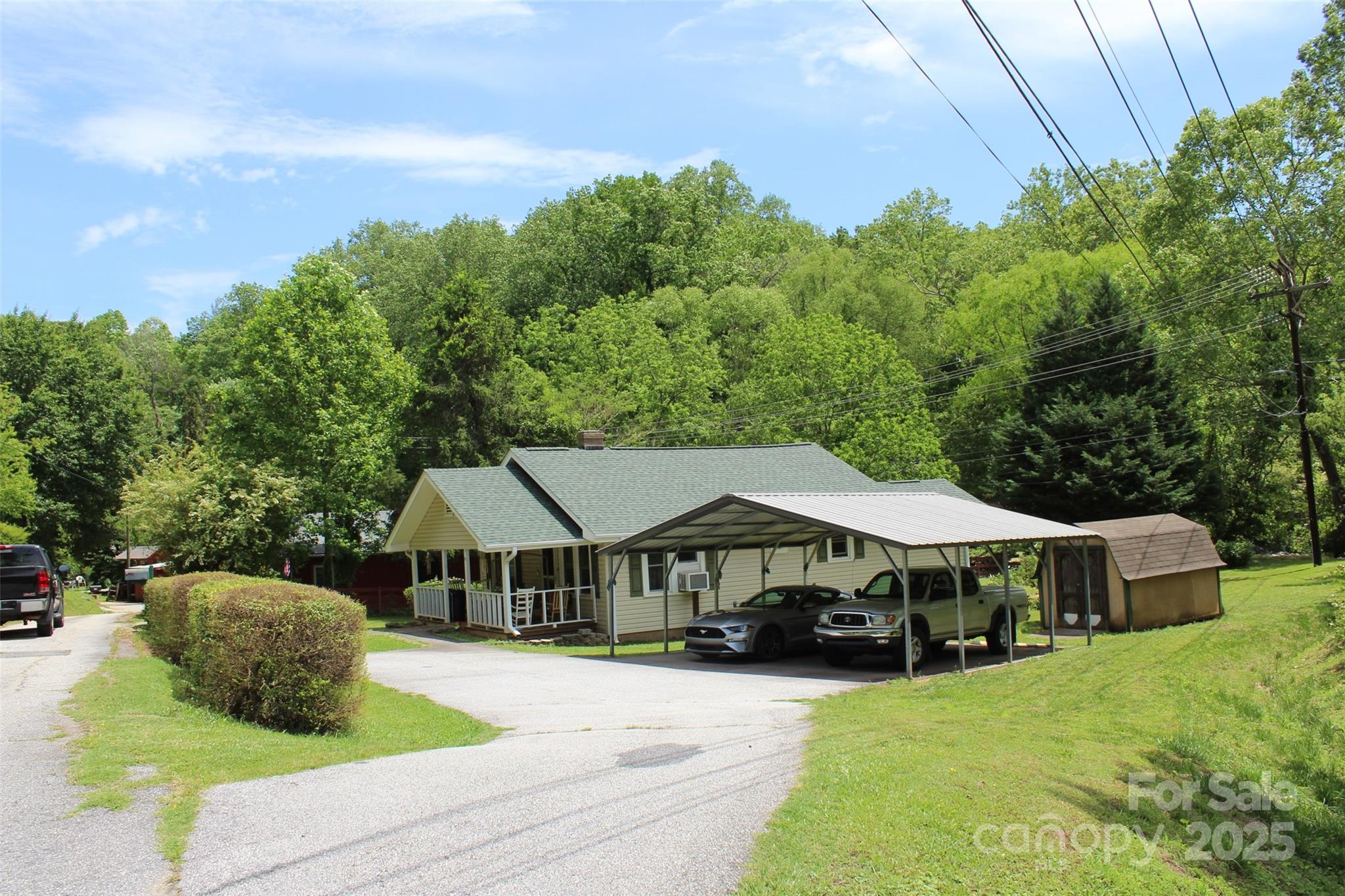 68 Rector Street Tryon, NC 28782 - Photo 9 of 29 a front view of a house with yard porch and furniture