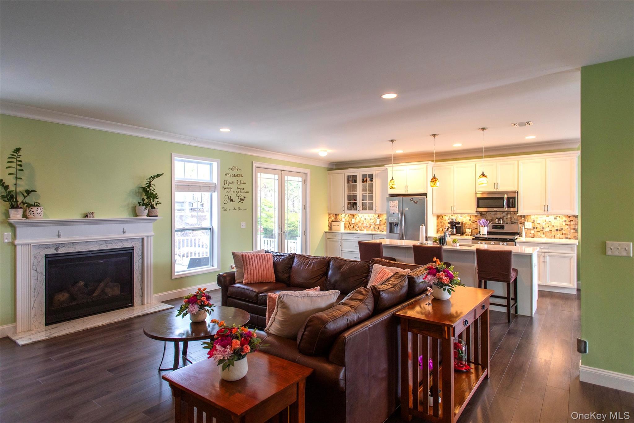 29 Wild Flower Drive Ridge, NY 11961 - Photo 11 of 45 a living room with furniture and a fireplace