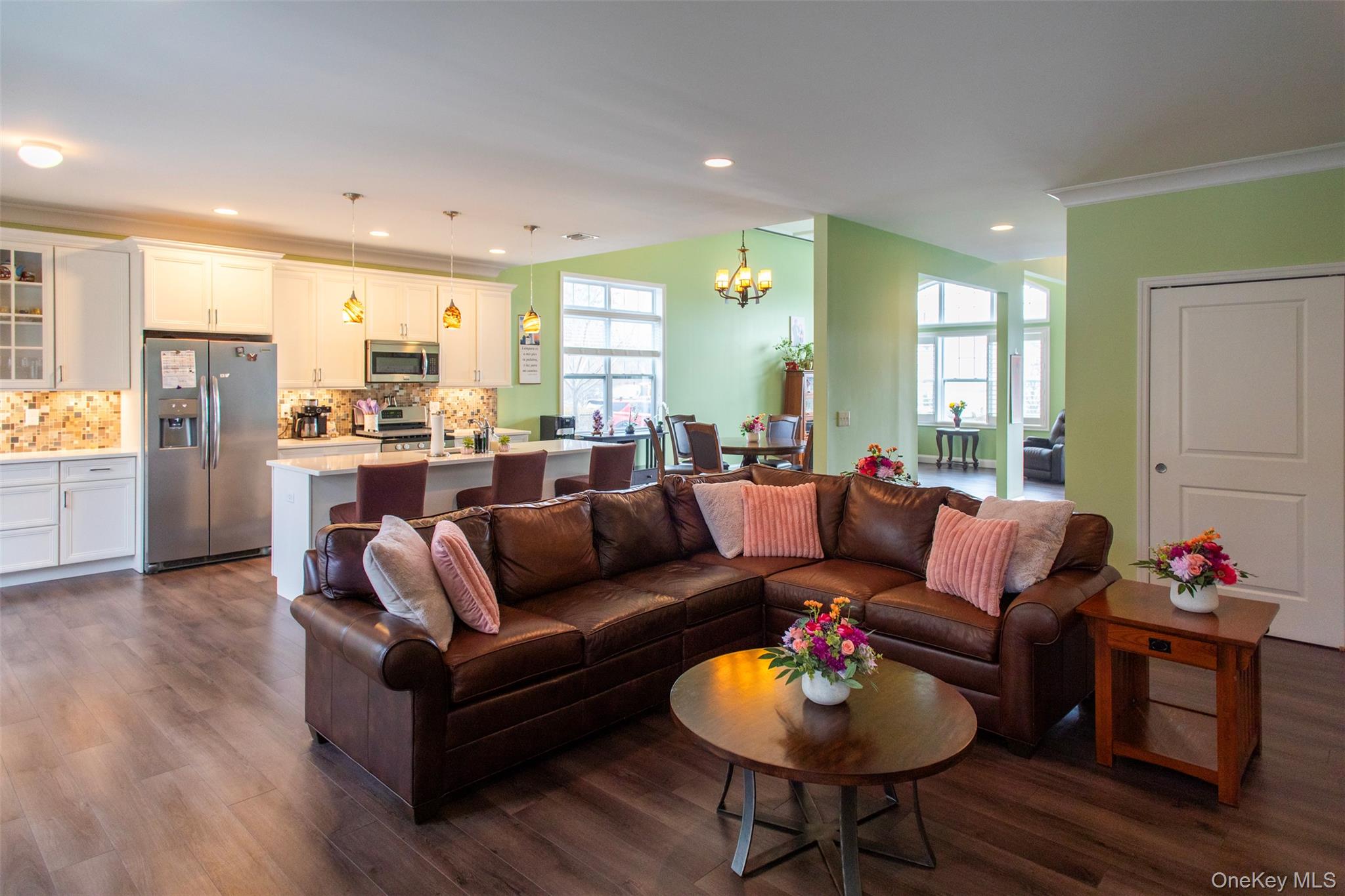 29 Wild Flower Drive Ridge, NY 11961 - Photo 12 of 45 a living room with furniture and a wooden floor