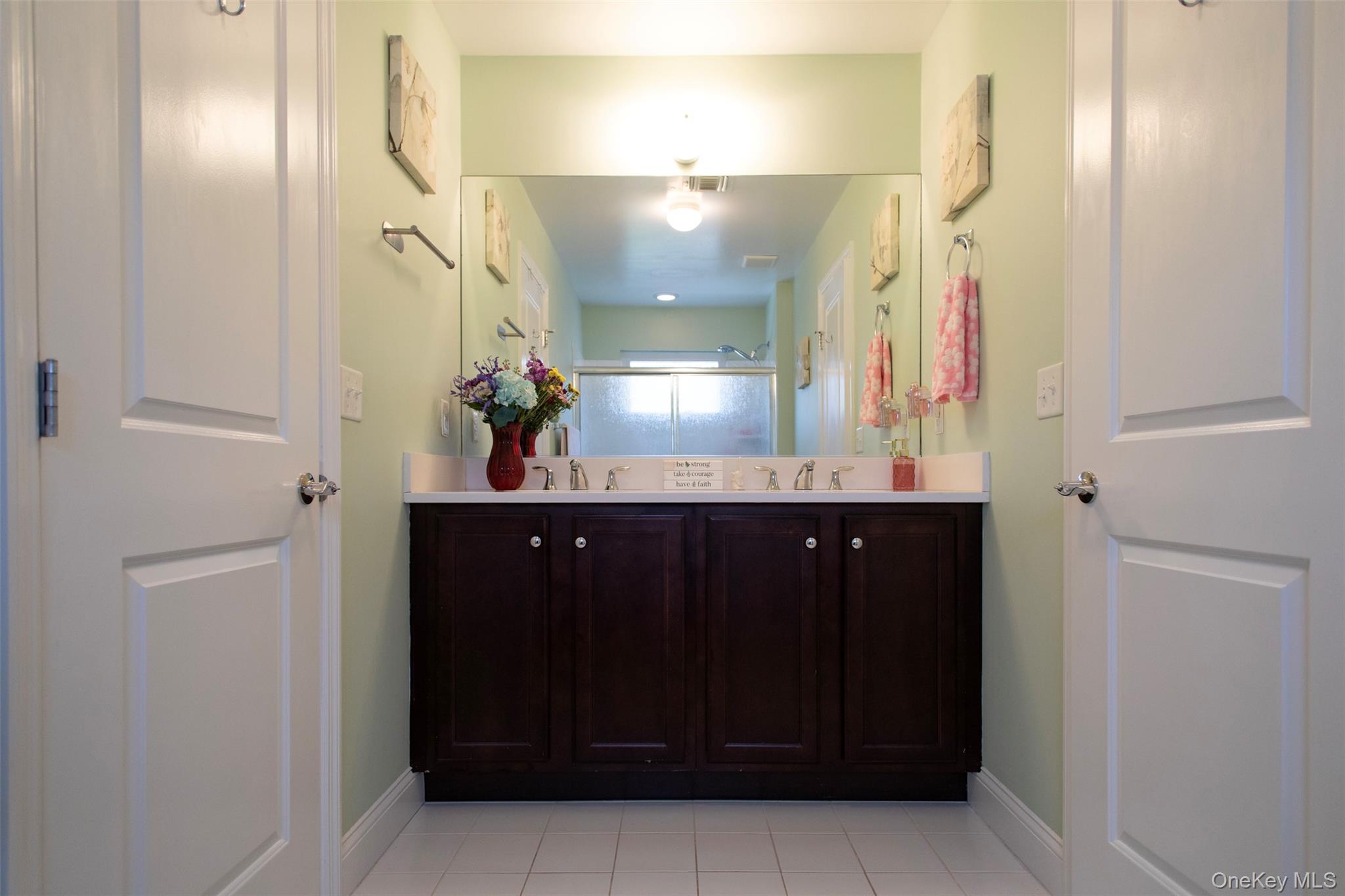 29 Wild Flower Drive Ridge, NY 11961 - Photo 13 of 45 a bathroom with a sink and a mirror
