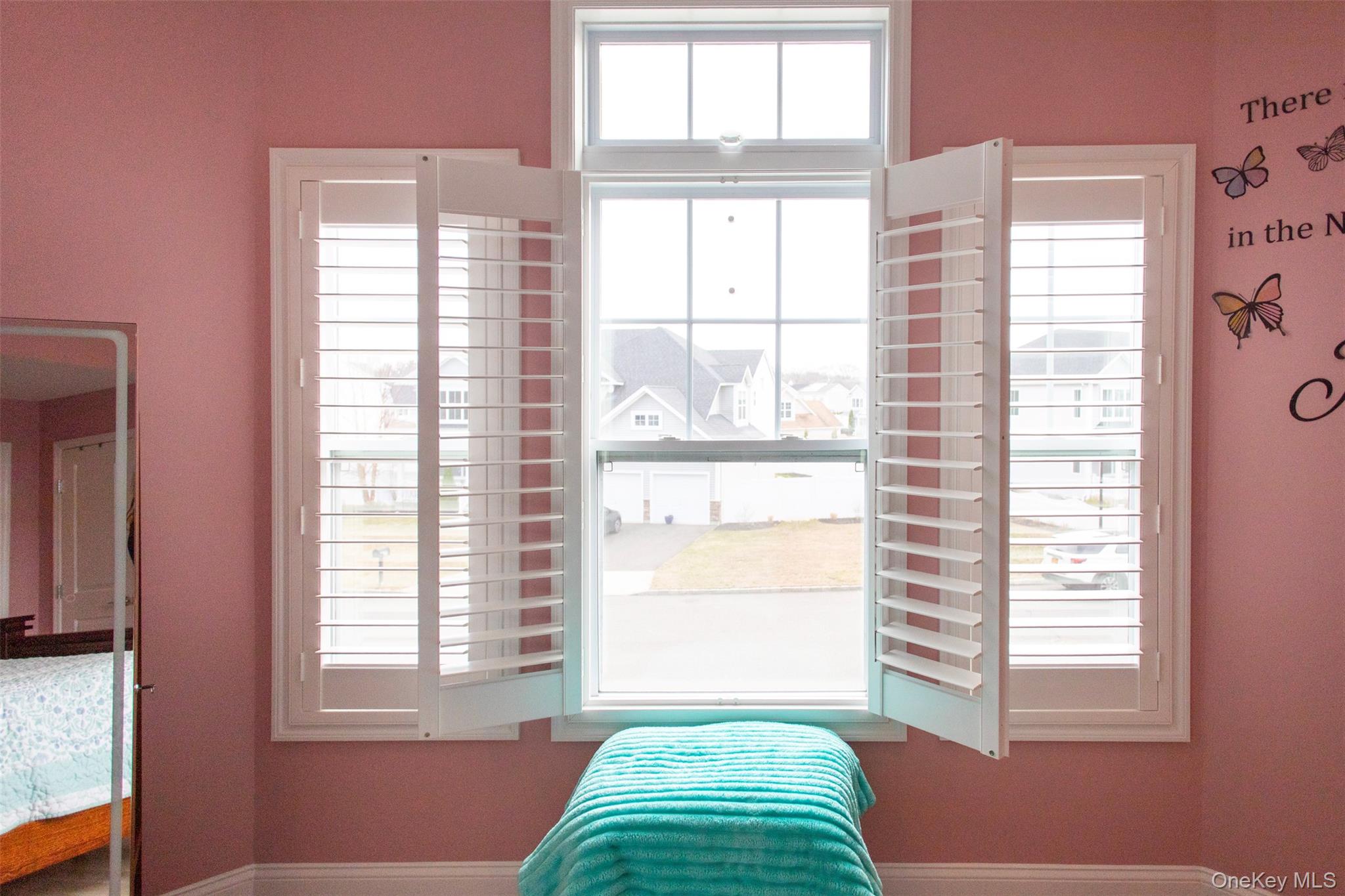 29 Wild Flower Drive Ridge, NY 11961 - Photo 23 of 45 a view of a bedroom with a window