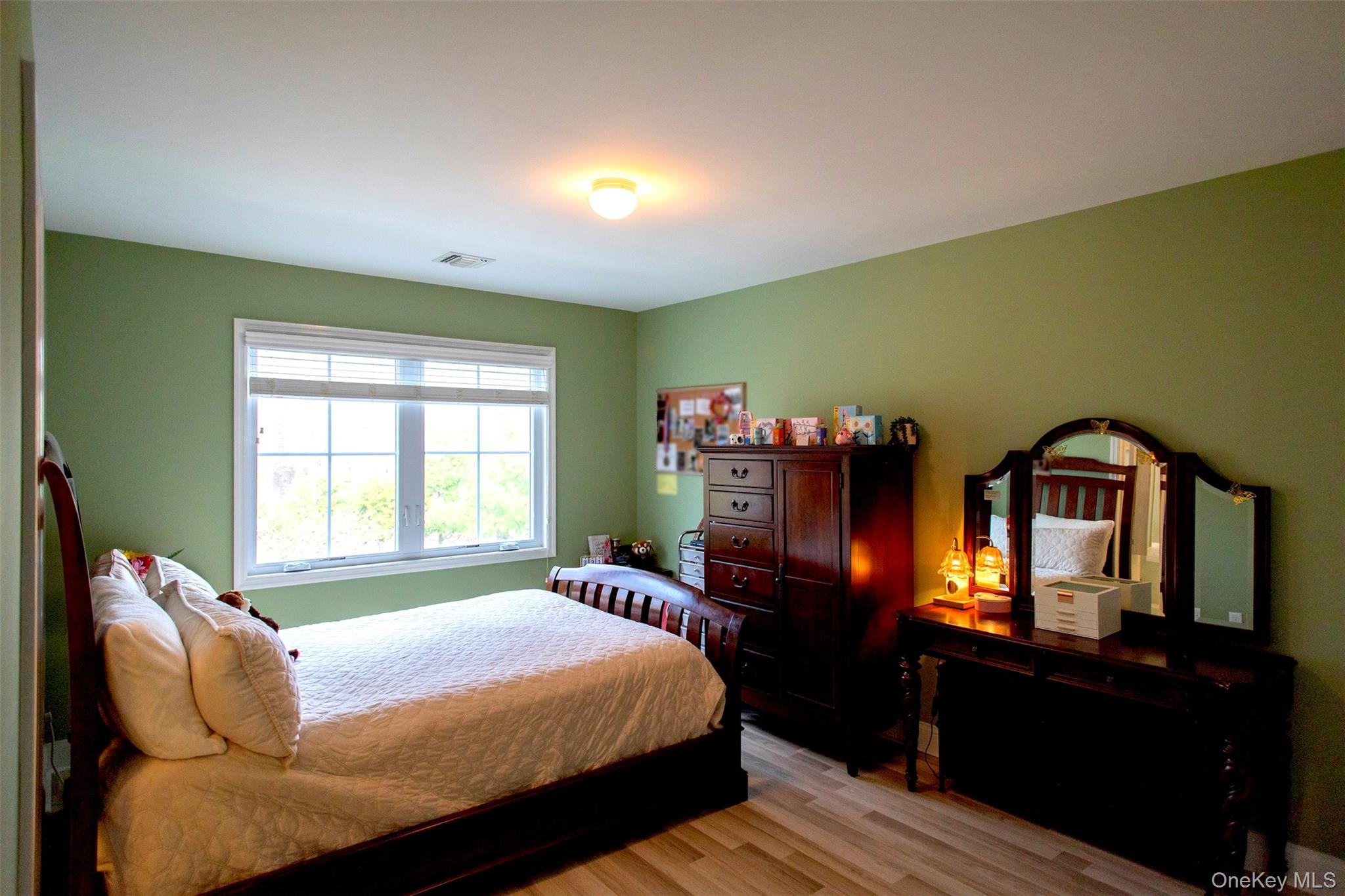 29 Wild Flower Drive Ridge, NY 11961 - Photo 24 of 45 a bedroom with a bed dresser and window