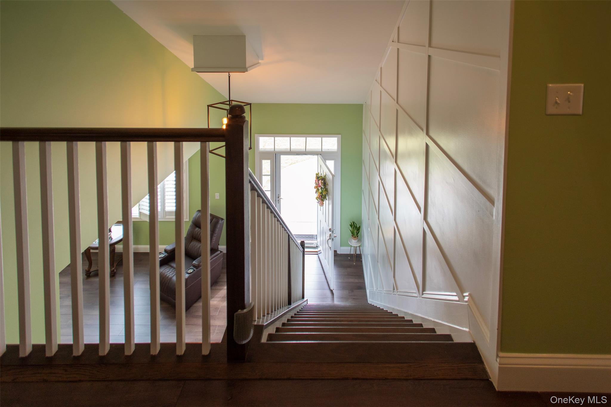 29 Wild Flower Drive Ridge, NY 11961 - Photo 26 of 45 a view of staircase with railing and a chandelier