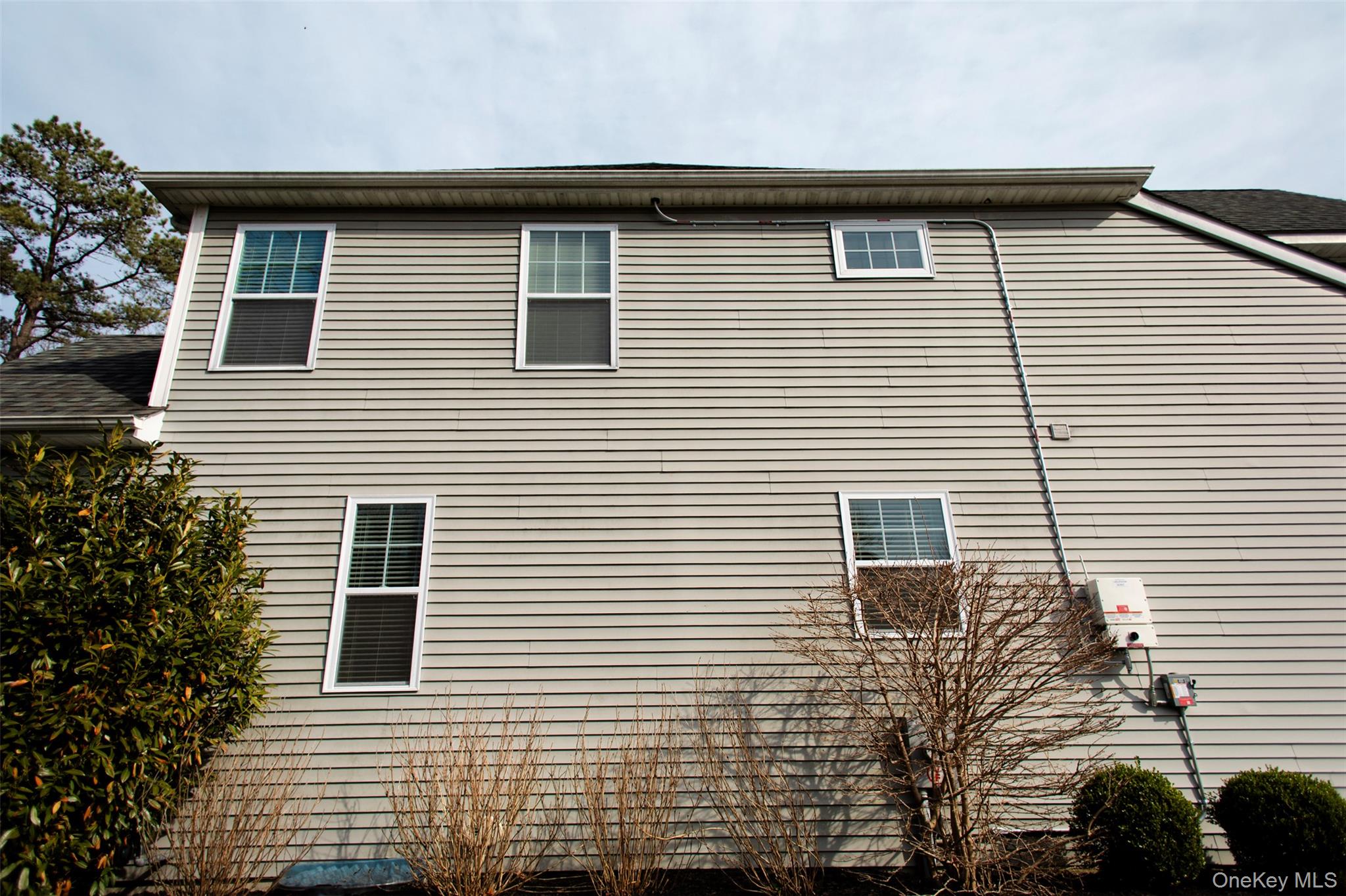 29 Wild Flower Drive Ridge, NY 11961 - Photo 27 of 45 a side view of a house