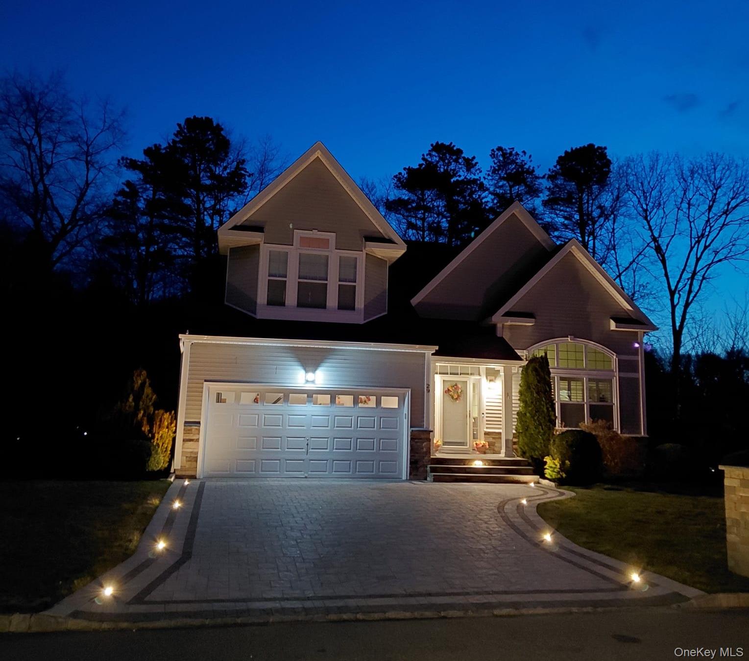29 Wild Flower Drive Ridge, NY 11961 - Photo 43 of 45 a front view of a house with a yard