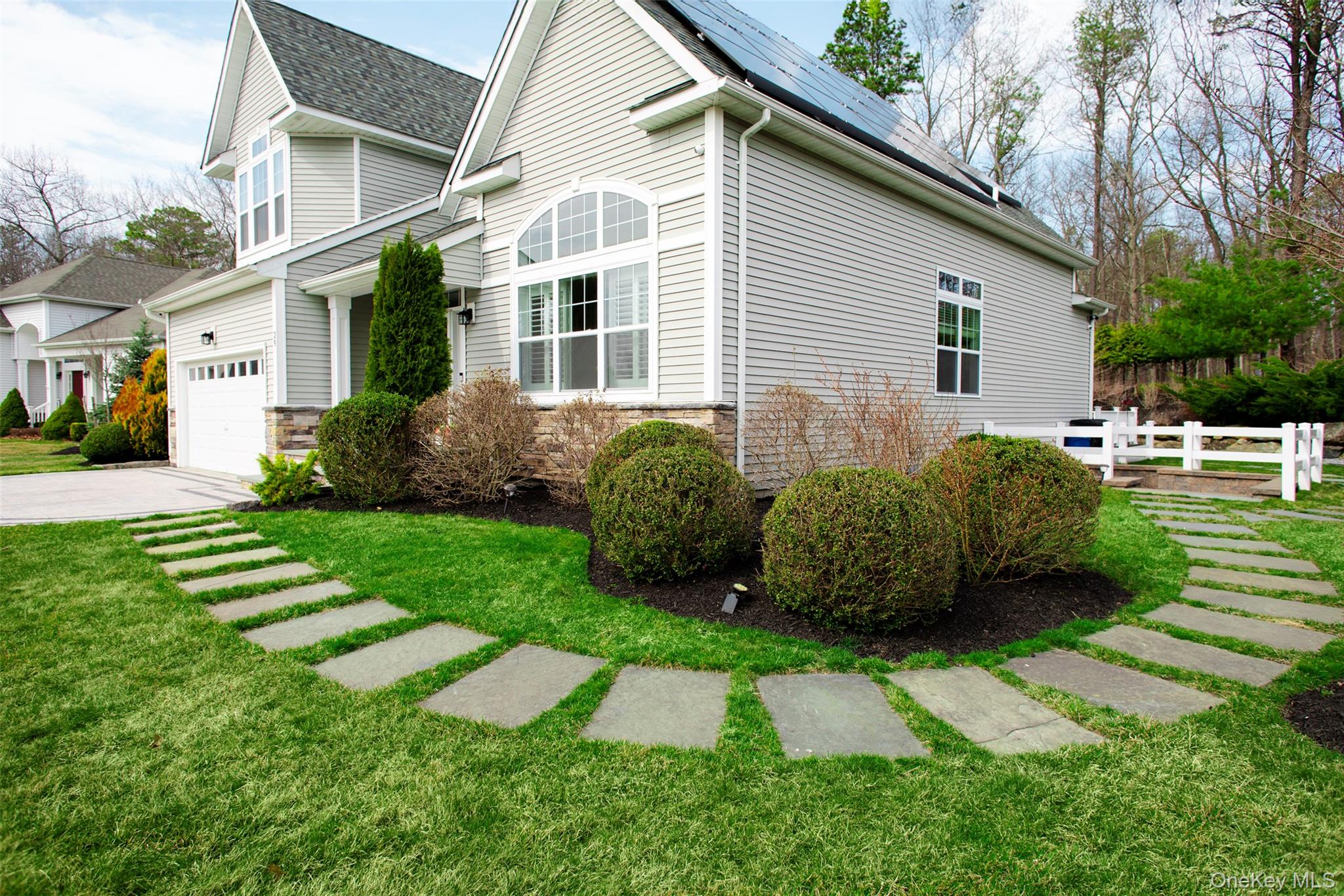 29 Wild Flower Drive Ridge, NY 11961 - Photo 5 of 45 a view of a house with a yard and plants