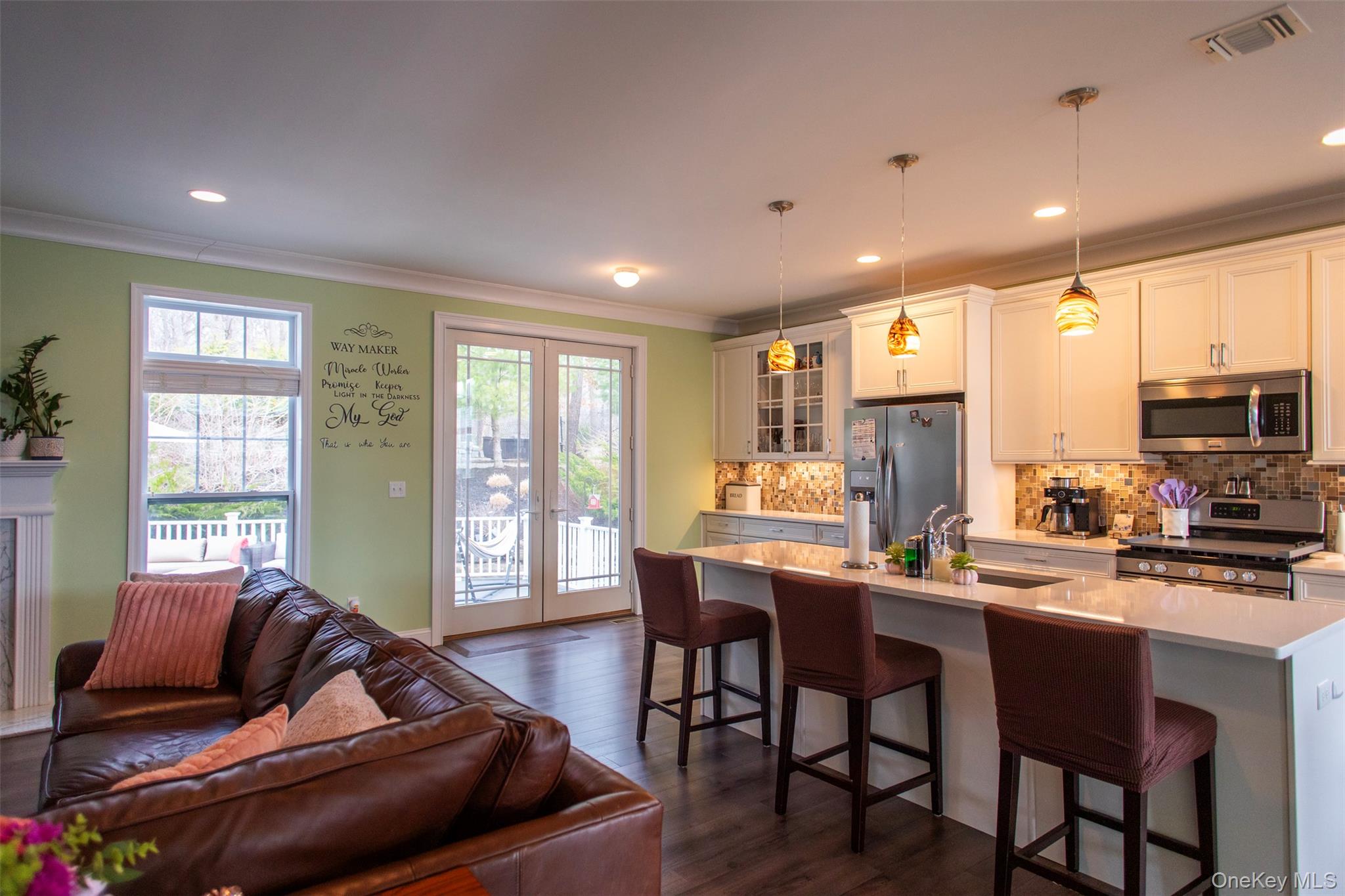 29 Wild Flower Drive Ridge, NY 11961 - Photo 6 of 45 a living room with stainless steel appliances kitchen island granite countertop furniture and a large window