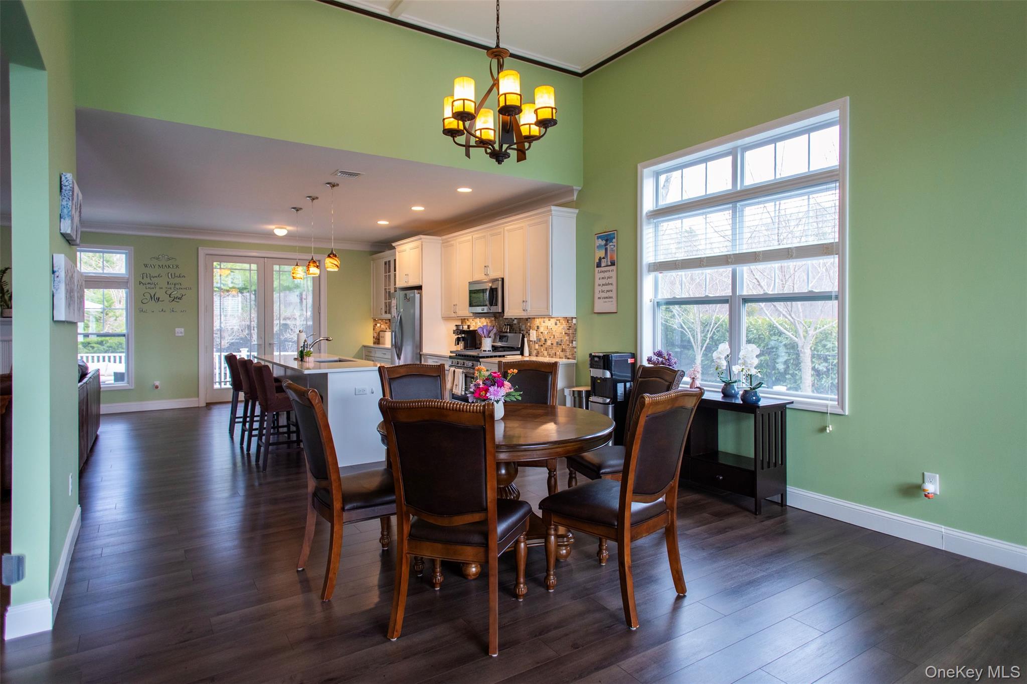 29 Wild Flower Drive Ridge, NY 11961 - Photo 7 of 45 a view of a dining room with furniture window and wooden floor