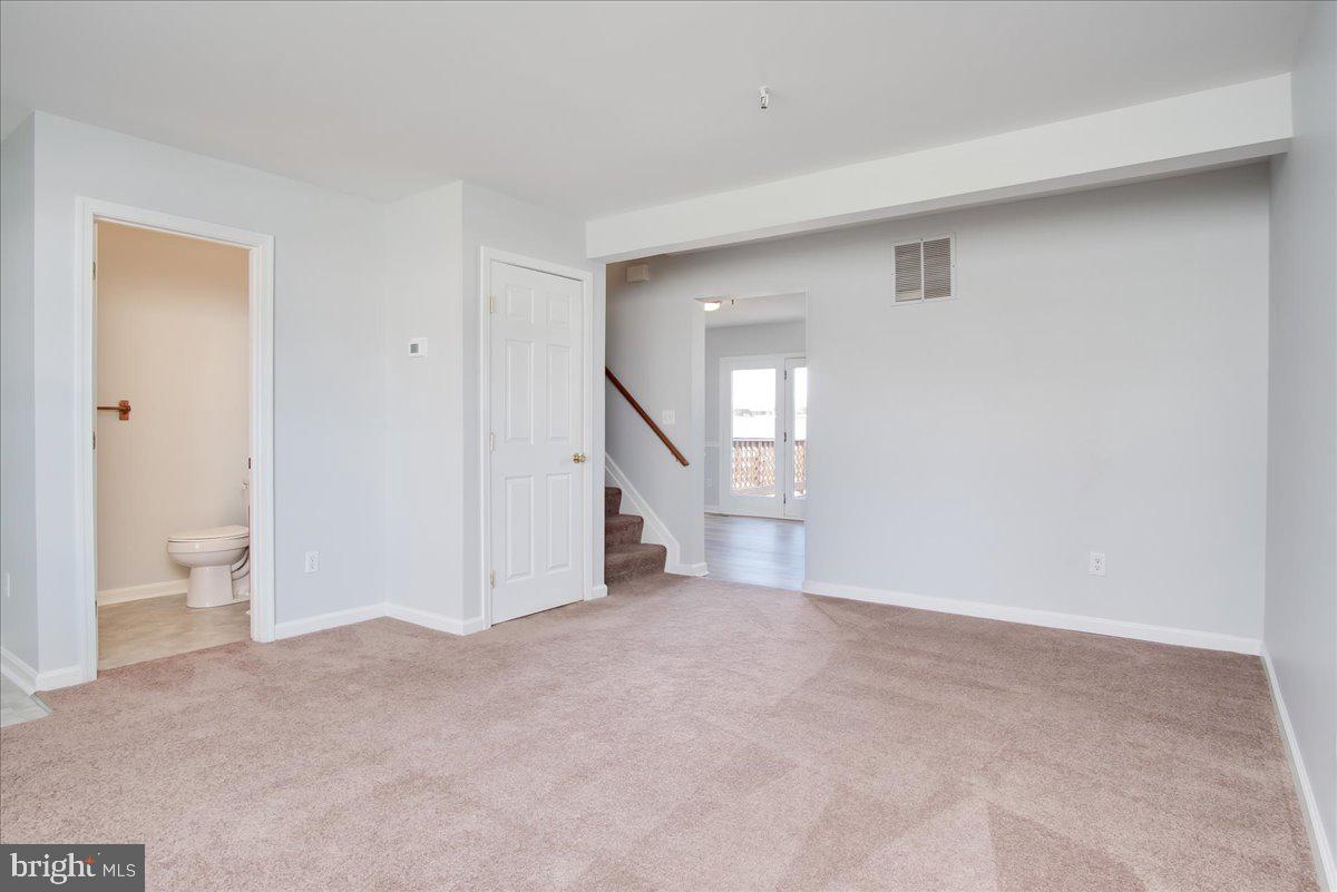 334 East Baltimore Street Taneytown, MD 21787 - Photo 4 of 31 a view of an empty room and a windows