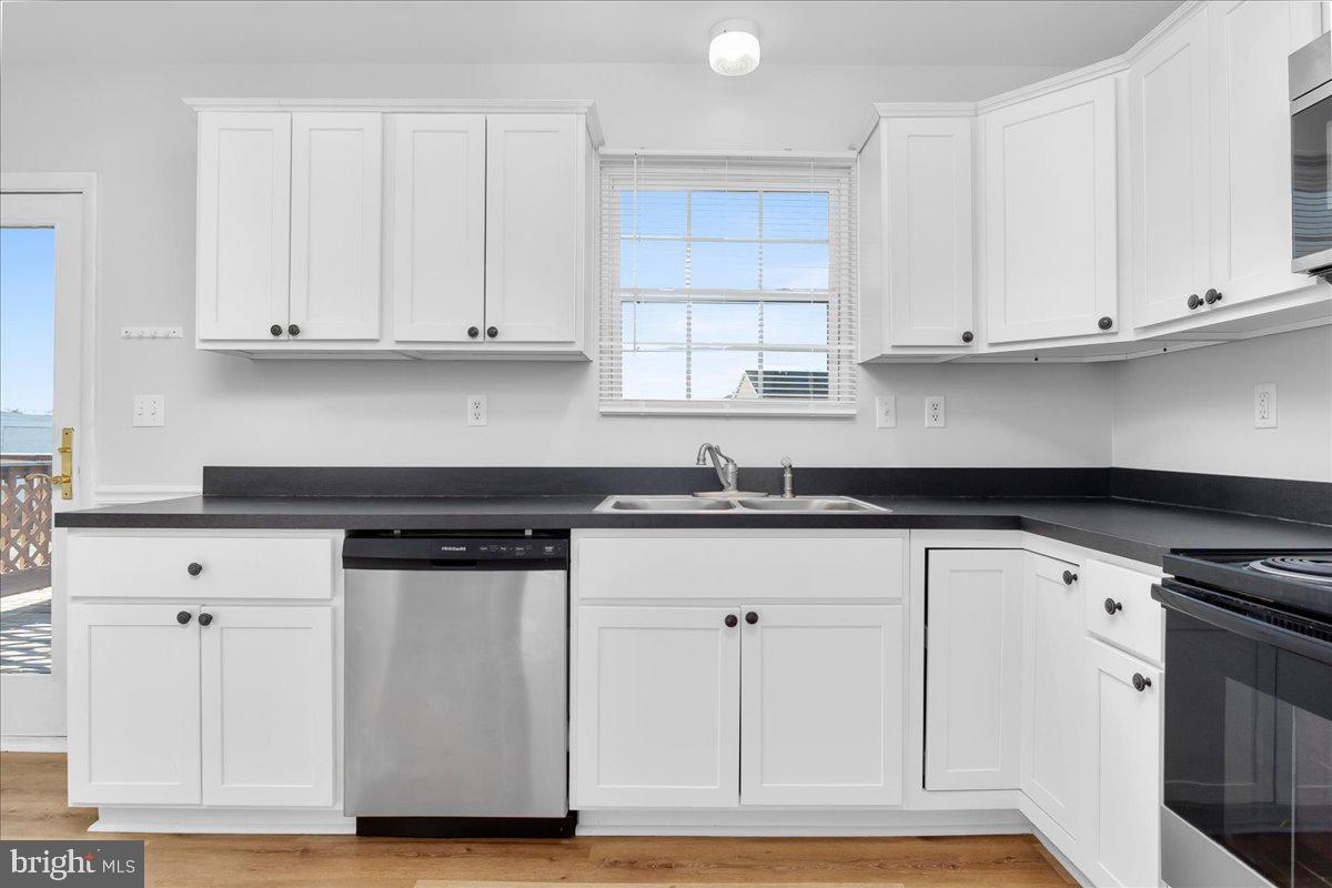 334 East Baltimore Street Taneytown, MD 21787 - Photo 7 of 31 a kitchen with white cabinets and a sink