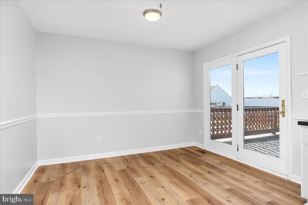334 East Baltimore Street Taneytown, MD 21787 - Photo 9 of 31 a view of a room with wooden floor and windows