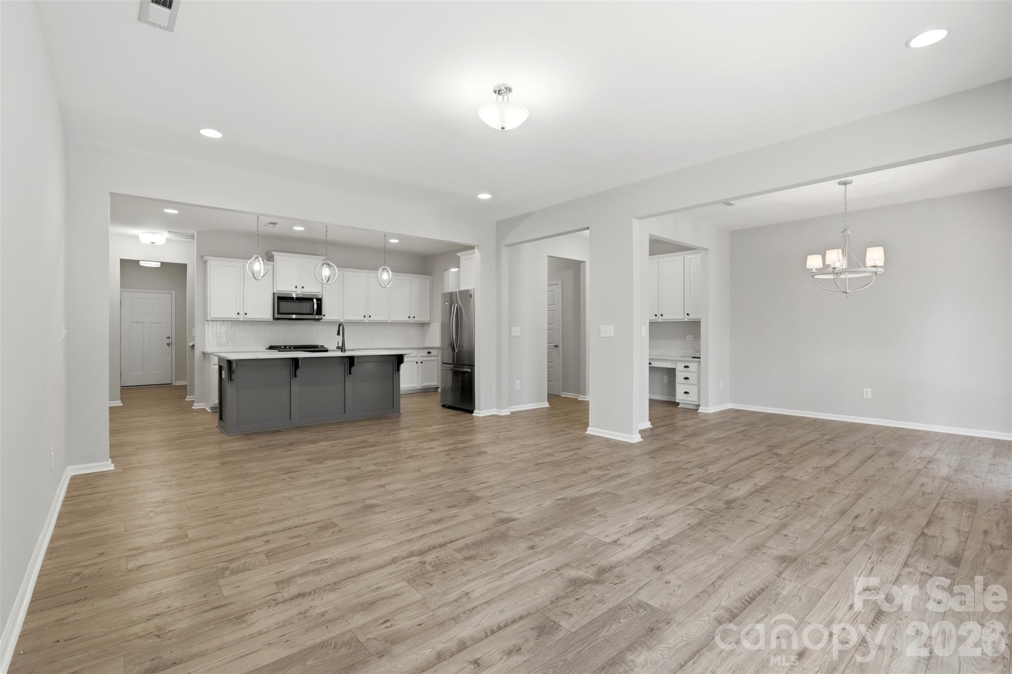 1117 Streamside Lane York, SC 29745 - Photo 11 of 25 a view of kitchen with kitchen island wooden floor and center island