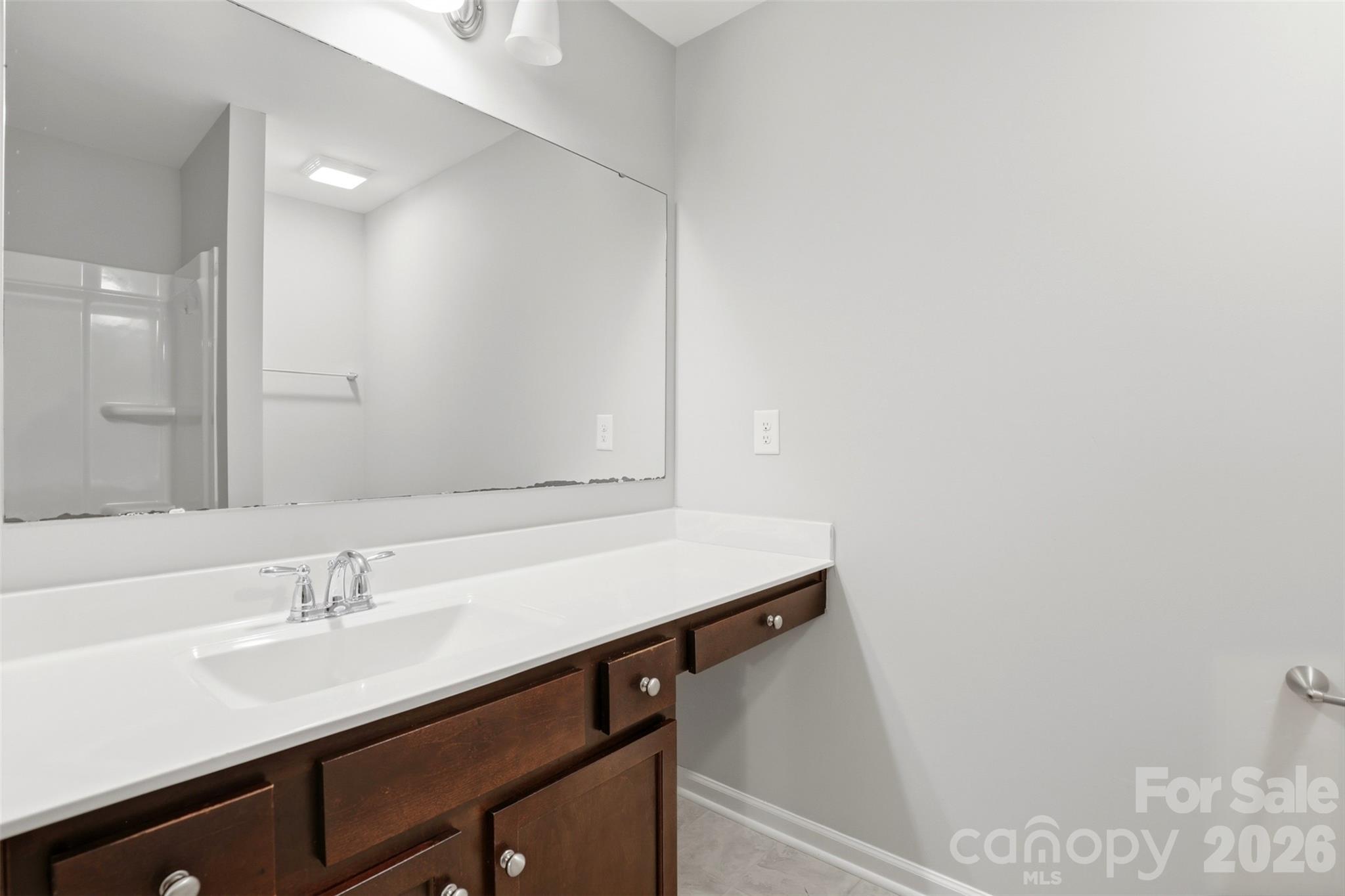 1117 Streamside Lane York, SC 29745 - Photo 18 of 25 a bathroom with a sink and a mirror