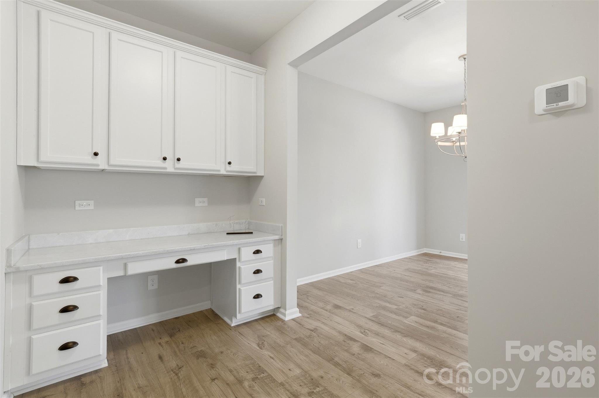 1117 Streamside Lane York, SC 29745 - Photo 10 of 25 a view of an empty room with cabinet and mirror