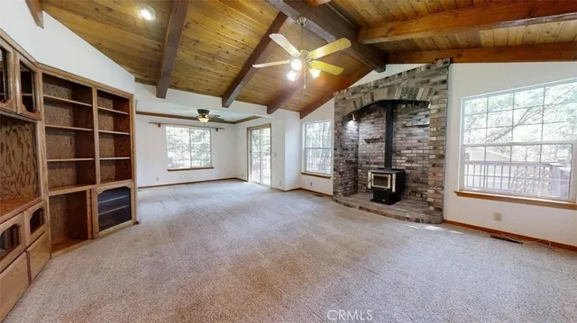 a view of empty room with ceiling fan