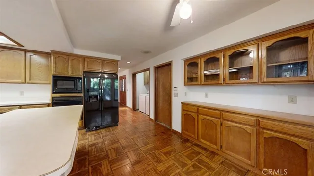 a view of empty room with a ceiling fan and window