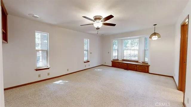 a bathroom with a granite countertop sink a mirror and a shower