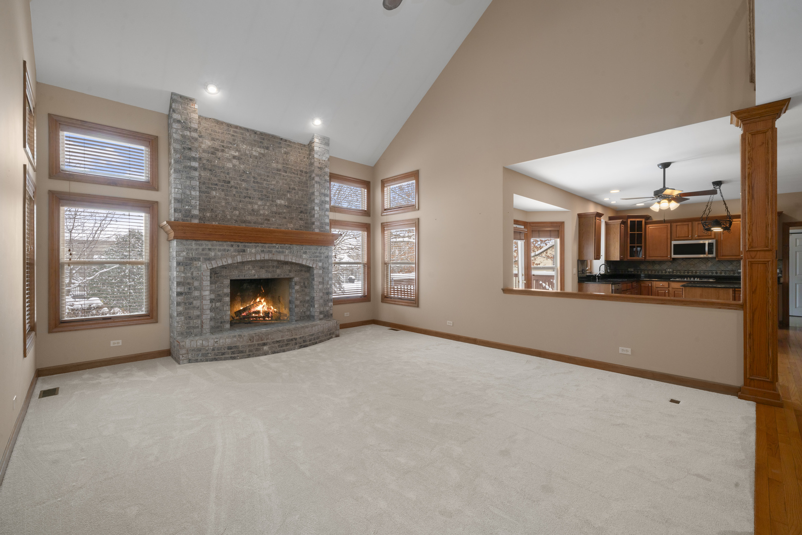 757 Merrill New Road Sugar Grove, IL 60554 - Photo 2 of 51 a view of an empty room with a fireplace and a window