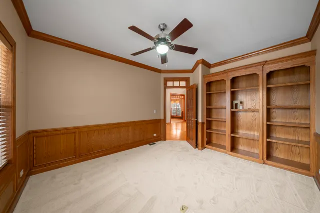 a bathroom with a granite countertop sink mirror vanity and toilet