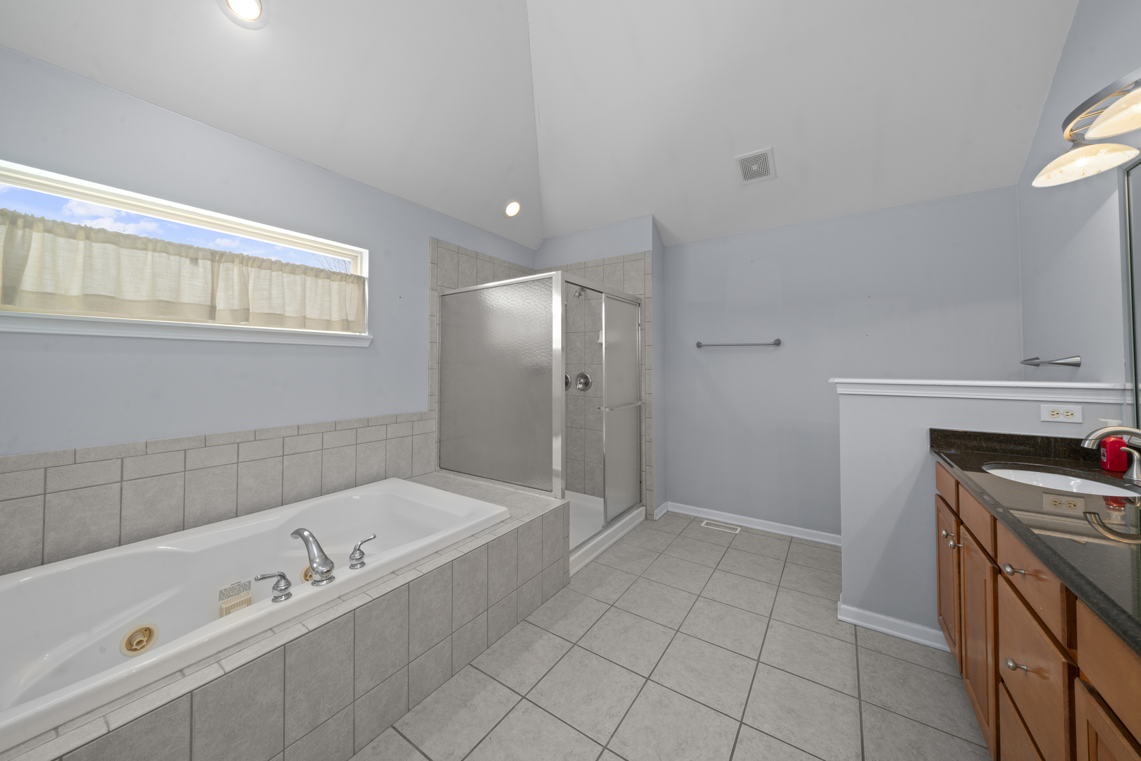 757 Merrill New Road Sugar Grove, IL 60554 - Photo 29 of 51 a bathroom with a tub sink and mirror