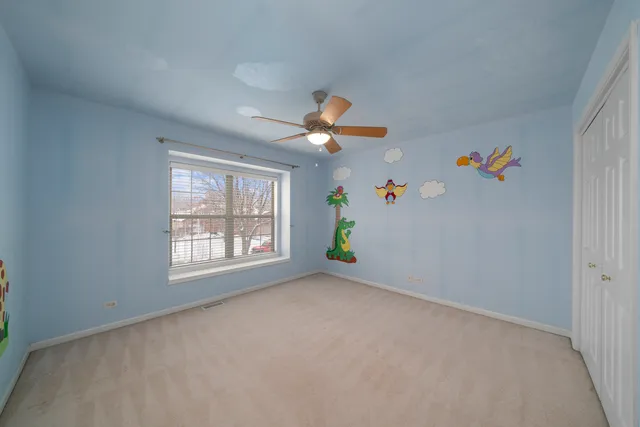 a bathroom with a granite countertop sink a large mirror and a bathtub