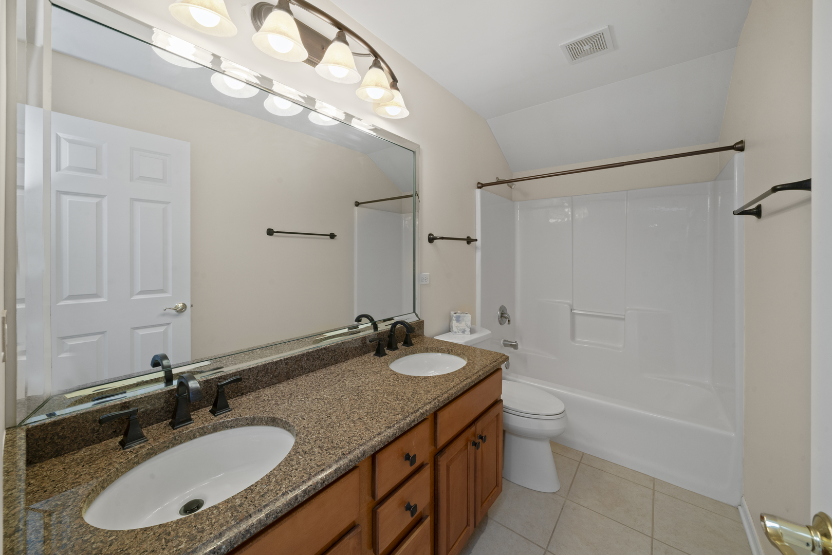 757 Merrill New Road Sugar Grove, IL 60554 - Photo 34 of 51 a bathroom with a granite countertop sink a large mirror and a bathtub
