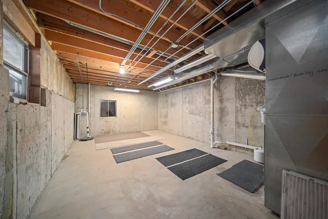 a view of a room with a door and a window