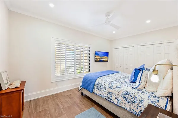 a bedroom with a large bed and a window