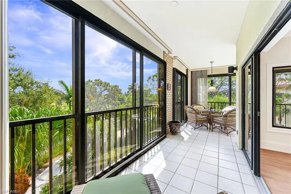 a view of a balcony with chairs
