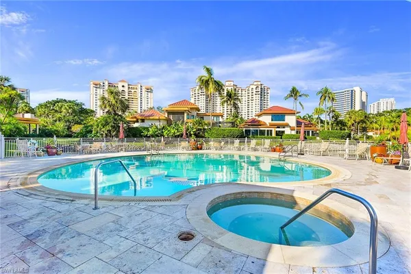 a view of a swimming pool with a patio
