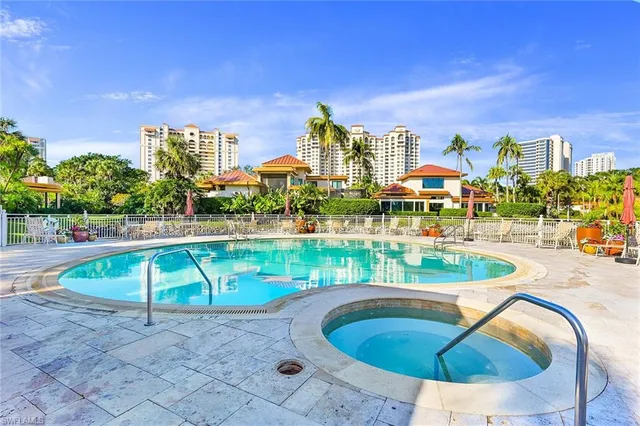 a view of a swimming pool with a patio