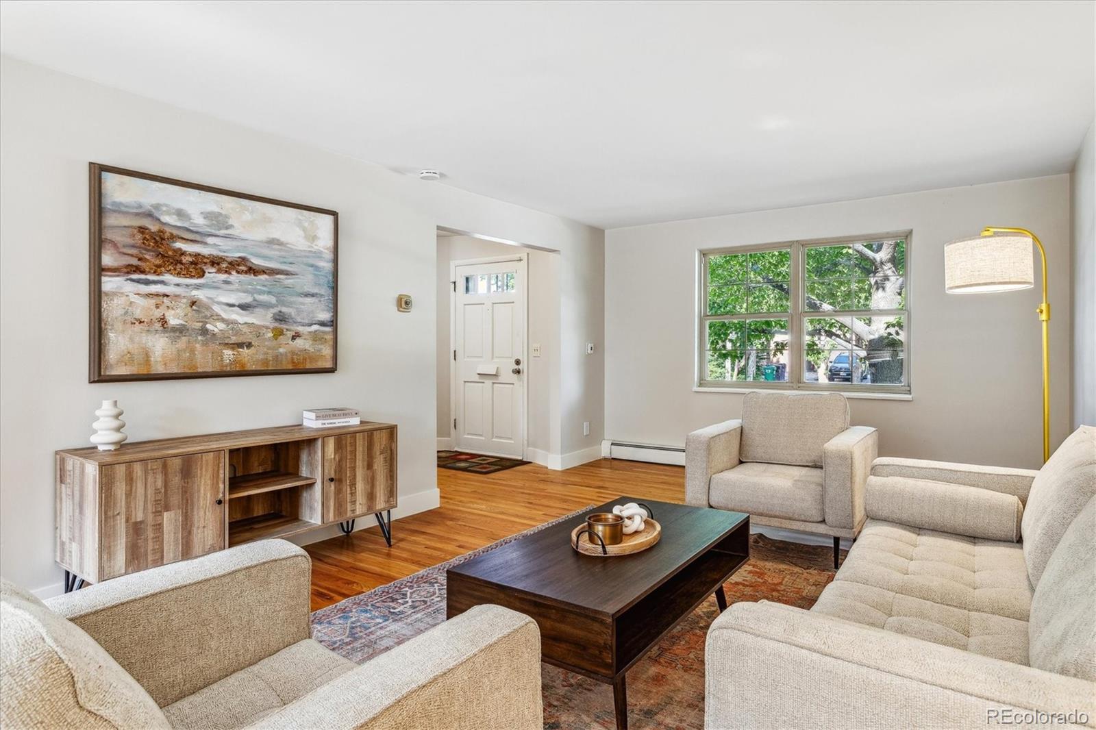 1975 South Locust Street Denver, CO 80224 - Photo 13 of 40 a living room with furniture and a flat screen tv