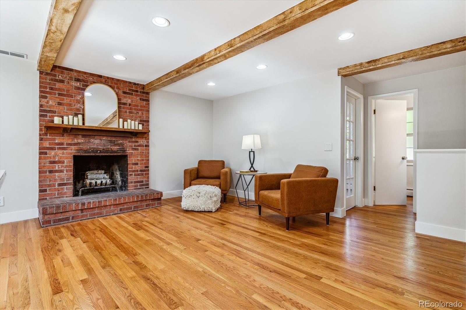 1975 South Locust Street Denver, CO 80224 - Photo 17 of 40 a living room with furniture and a fireplace